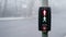 UK traffic crossing with All lights Illuminated on a cold foggy day