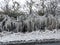 UK weather with icicles formed from splashed road water