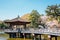 Ukimido pavilion on pond with cherry blossoms in Nara, Japan