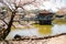 Ukimido pavilion on pond with cherry blossoms in Nara, Japan