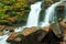 Ukpaine. Waterfall among the mossy rocks. Beautiful landscape rapids on a mountains river in autumn forest in carpathian