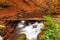 Ukpaine. Waterfall among the mossy rocks. Beautiful landscape rapids on a mountains river in autumn forest in carpathian