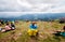 UKRAINE - August 24. 2019. Patriot woman with national Ukrainian flag seat at top of Hoverla Mount, Carpathian and praying for