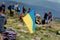 UKRAINE - August 24. 2019. Yellow-blue national Ukrainian flag waving at top of Hoverla Mount, Carpatian.A symbol of the Ukrainian