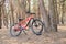 Ukraine Dnipro 05.04.2021 - a red electric bike is recharged in a forest in a park, new technologies