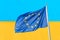 Ukraine and European Union. Waving European Union flag against blue yellow wall ukrainian flag. Ukraine goes to Europe concept