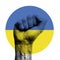 Ukraine flag circle emblem over a clenched fist. Strength, Power, Protest concept