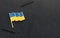 Ukraine flag lapel pin on the collar of a suit