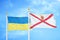 Ukraine and Jersey two flags on flagpoles and blue sky