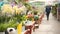 Ukraine, Kharkov, May 2021 Flowers market with houseplant assortment People walking