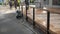 Ukraine, Kharkov May 2021 man cleaning terrace with a power washer - high water pressure cleaner on wooden terrace