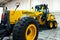 Ukraine, Kiev - November 5, 2019: Powerful road construction equipment with a bucket . Grader Liugong Side View