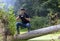 Ukraine, Kyiv, August 25, 2018: A young guy makes a landscape photographing camera Canon. Removes a small swamp in the forest