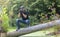 Ukraine, Kyiv, August 25, 2018: A young guy makes a landscape photographing camera Kenon. Removes a small swamp in the forest