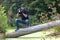 Ukraine, Kyiv, August 25, 2018: A young guy makes a landscape photographing camera Kenon. Removes a small swamp in the forest