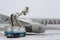 Ukraine, Kyiv - February 12, 2021: De-icing the aircraft before the flight. The deicing machine sprinkles the wing of a