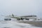 Ukraine, Kyiv - February 12, 2021: De-icing the aircraft before the flight. The deicing machine sprinkles the wing of a passenger