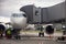 Ukraine, Kyiv - July 8, 2020: Passengers boarding and disembarking from the plane through the boarding bridge. Aircraft