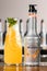 UKRAINE, KYIV - MARCH 11, 2021: Close-up of bottle of tangerine syrup by Monin and glass carafe of iced cocktail with