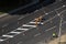 UKRAINE, KYIV - May 25, 2020: Road workers painting marking white line on the road surface. Thermoplastic spray marking