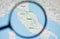 UKRAINE, ODESSA - APRIL 25, 2019: Italy on google maps through magnifying glass.