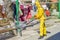 Ukraine, Odessa, spring 2020. Coronavirus. Sanitation worker in a yellow special suit and mask, washes the street with an alcohol