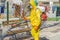 Ukraine, Odessa, spring 2020. Coronavirus. Sanitation worker in a yellow special suit and mask, washes the street with an alcohol