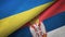 Ukraine and Serbia two flags textile cloth, fabric texture