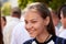 Ukraine, Shostka - September 3, 2019: Portrait of a smiling teenager girl on a crowded street