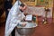 Ukraine,Shostka, Vladimirskaya Church -March 3, 2019: The priest performs the rite of the sacrament of baptism