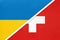 Ukraine and Switzerland, symbol of country. Ukrainian vs Swiss national flags