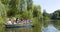 Ukraine - Uman, Sofiyivka Park - June 10, 2017: Tourists float on a boat to enjoy the lively landscapes.