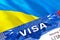 Ukraine visa stamp in passport with VISA text. Passport traveling abroad concept. Travel to Ukraine concept - selective focus,3D