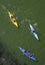 Ukraine, Zaporozhye, the Dnipro river, August 24, 2019 - three kayaks sail on the green surface of the water