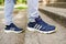 UKRAINE, ZAPOROZHYE - MAY 24, 2020 : male feet in blue Adidas shoes outdoors