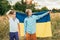 Ukraines Independence Flag Day. Constitution day. Ukrainian child boy in shirt with yellow and blue flag of Ukraine in