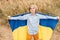 Ukraines Independence Flag Day. Constitution day. Ukrainian child boy in shirt with yellow and blue flag of Ukraine in field