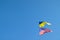 Ukrainian and American flag on a blue sky background. Friendship of peoples and diplomatic mission. Yellow-blue and stars-striped