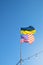 Ukrainian and American flag on a blue sky background. Friendship of peoples and diplomatic mission. Yellow-blue and stars-striped