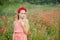 Ukrainian Beautiful girl in field of poppies and wheat. outdoor portrait in poppies