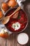 Ukrainian borsch soup and garlic buns close-up. vertical top vie