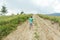 The Ukrainian boy goes up the mountain road forward. Motivating photo