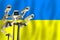 Ukrainian CCTV camera on the flag of Ukraine. Surveillance, security, control and totalitarianism concept