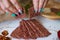 Ukrainian Crispbread  with beetroot and tomato in hands. Healthy diet food. Bread cakes on a white background in the ingredient