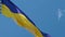 Ukrainian flag fluttering in the wind. National flag against a blue sky,