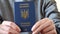 Ukrainian foreign biometric passport in hand, close-up.