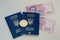 Ukrainian foreign passports and money and bitcoin coin. Ukraine and cryptocurrency concept. on white