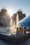 Ukrainian girls sits on the fountain at a hot day on Independence Square in Kiev, Ukraine.