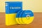 Ukrainian language textbook with flag of Ukraine and CD discs on