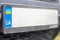 Ukrainian license plate without numbers and letters on the bumper close-up. Symbol of nationality and yellow-blue flag. Individual